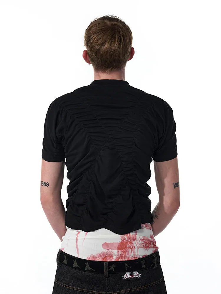 Black men's slim fit short sleeve T-shirt with round neck on a grey background.