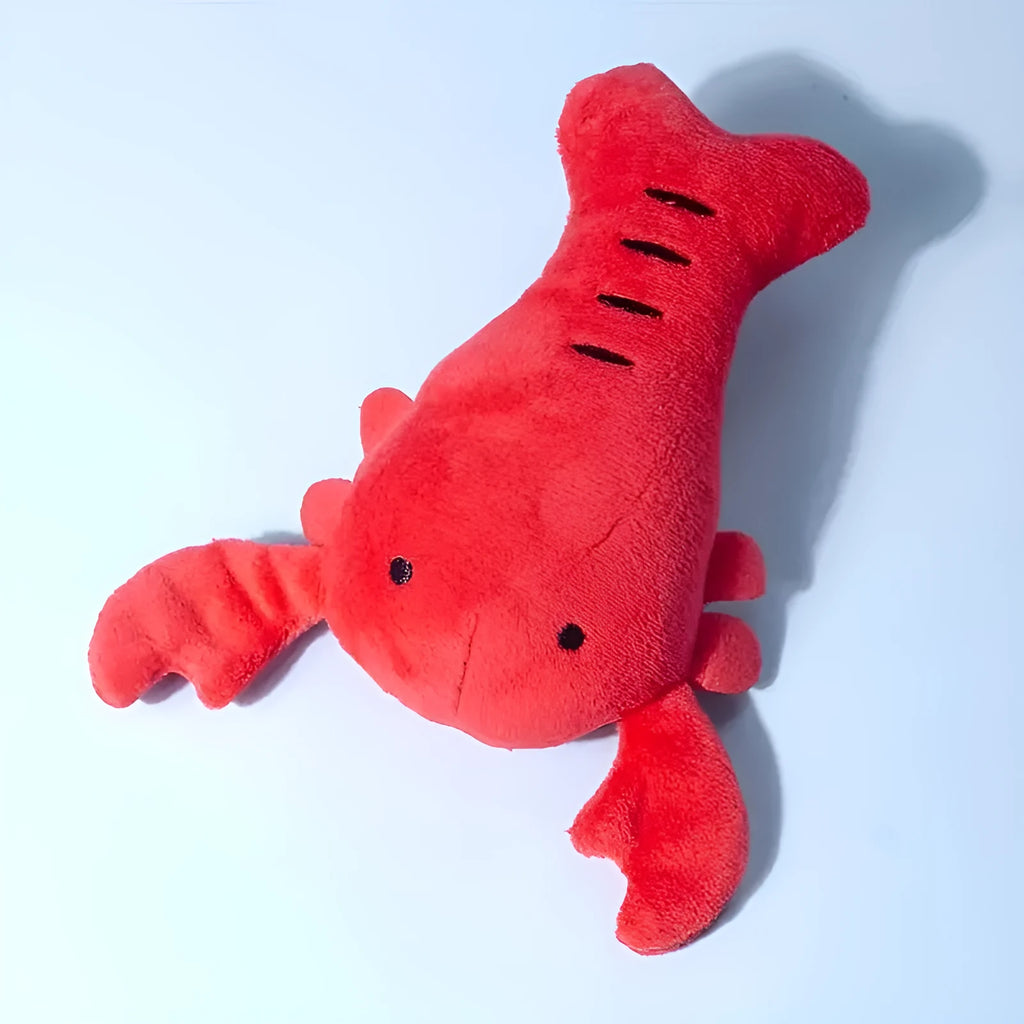 Red plush lobster-shaped squeaky dog toy for small and medium breeds.