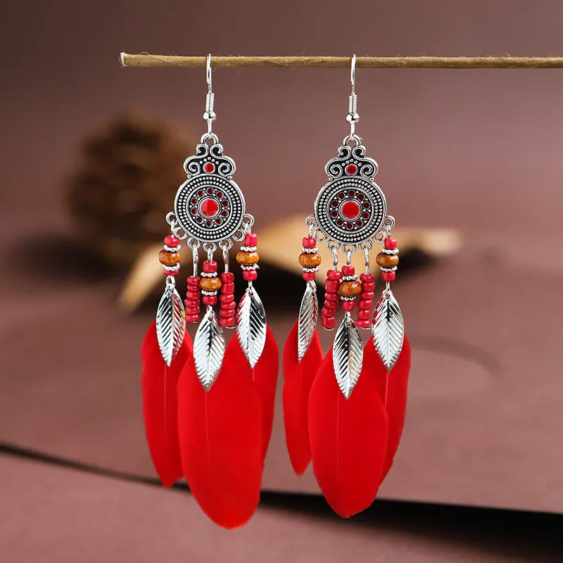 Round drop feather design alloy earrings with leaf pattern in a bohemian style, showing electroplated finish.