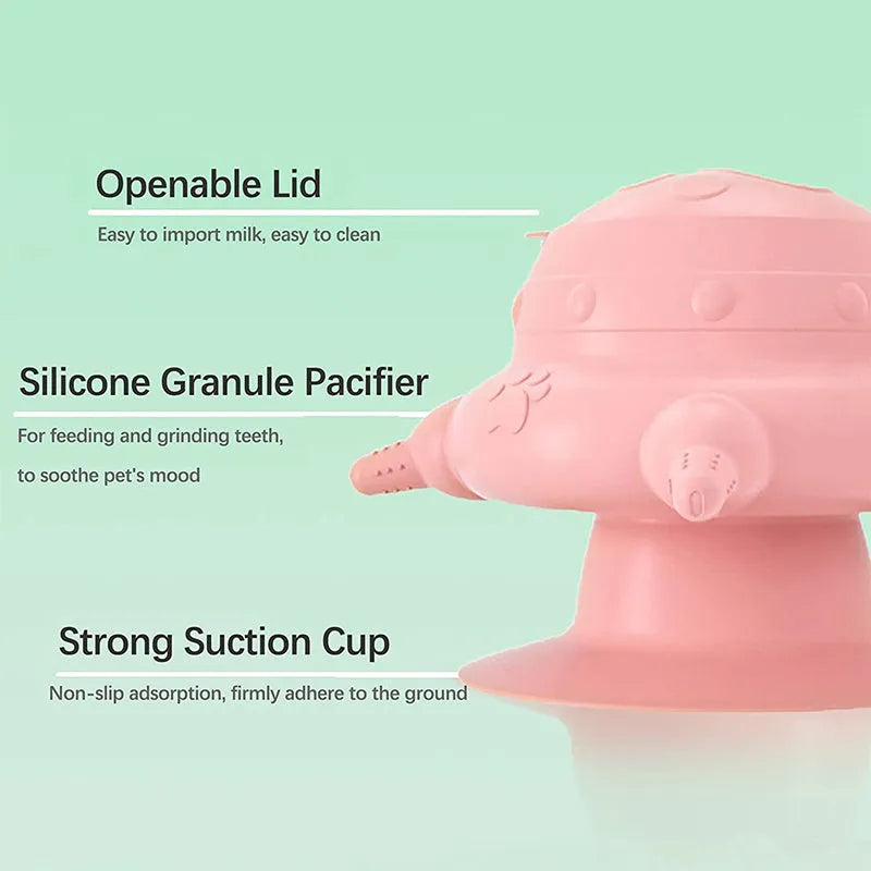 Pink silicone pet nursing feeder with bionic breast-shaped bowl and four pacifiers on a white background.