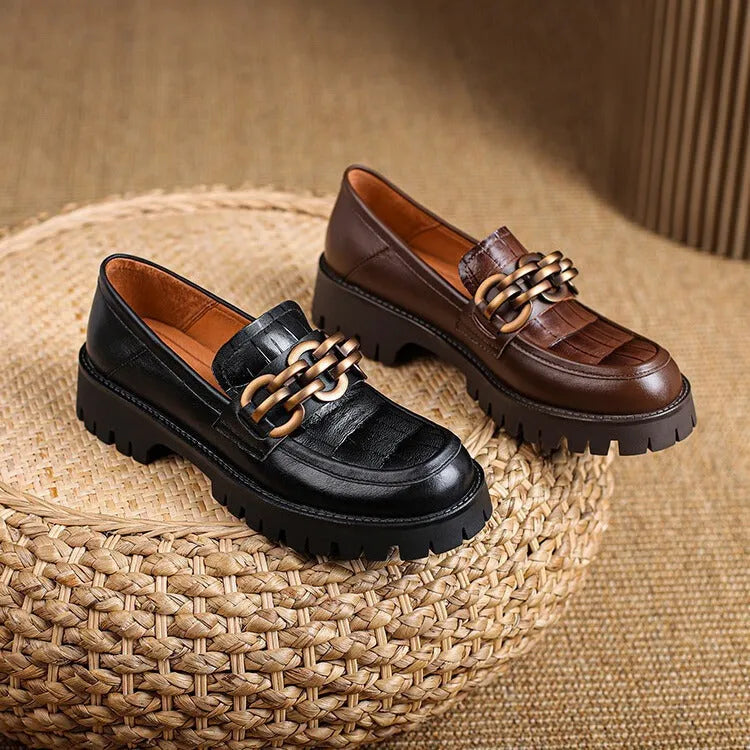 Retro platform loafers in brown cowhide patterned leather with a round toe and rubber sole
