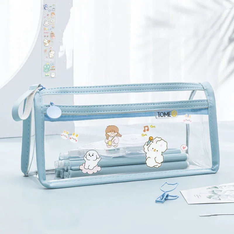 Large transparent double-layer pencil case in blue showing internal compartments, dimensions 220x110x80mm.