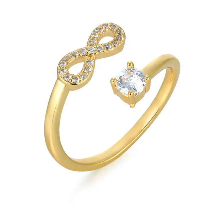 Open geometric ring with zircon stones featuring an English letter, available in gold, rose gold, and silver finishes.