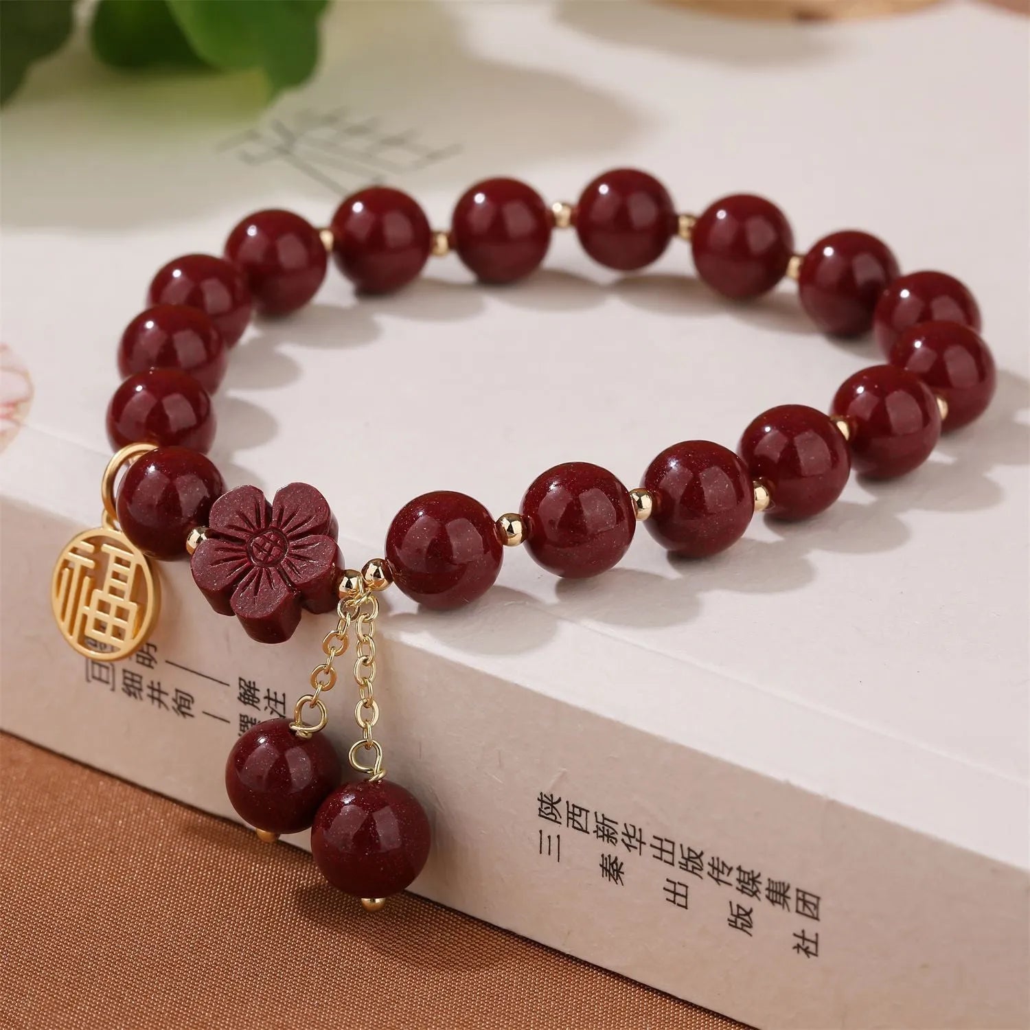 Women's cinnabar bracelet with purple gold sand colour and Fu character design elements