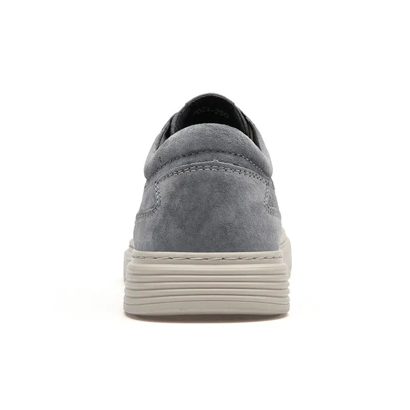 Men's grey casual leather skate shoes with round toe, low top design and rubber soles