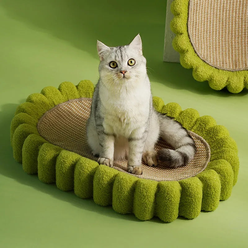 Green oval cat scratcher bed made from sisal, showing its bowl shape and textured scratching surface.
