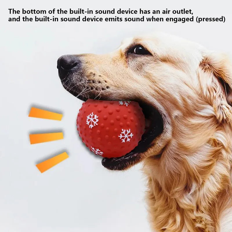 Red dog toy ball with squeaker and air vents, 7 cm diameter, floating on water