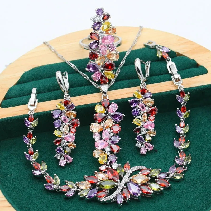 Retro floral pattern jewellery set with necklace, earrings, ring, and bracelet in olive or purple colours