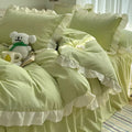 Solid colour washed linen quilt cover and pillowcases from a mori style four-piece bedding set.