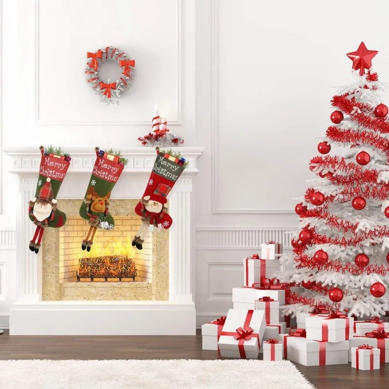 Set of three large 18-inch Christmas stockings with Santa, Snowman, and Reindeer 3D applique designs, hanging on a wooden mantel with festive decorations.