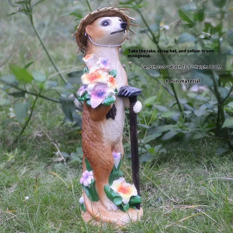 Three resin mongoose garden ornaments with straw hats, including figures holding rake and shovel tools