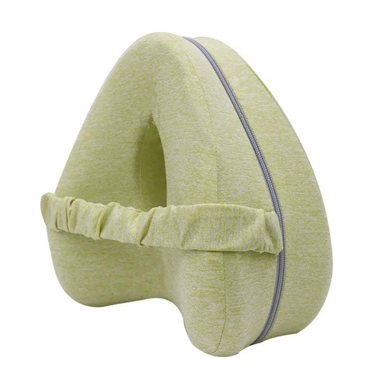 Love heart-shaped dark blue memory foam leg pillow for adult knee and leg support.