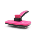 Automatic dehairing comb with stainless steel teeth and rose red handle, for dog and cat grooming, on a white background