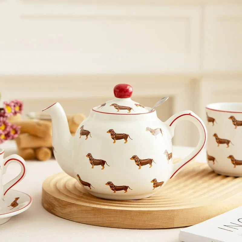 Ceramic sausage dog teapot mug cup and saucer three-piece set on table