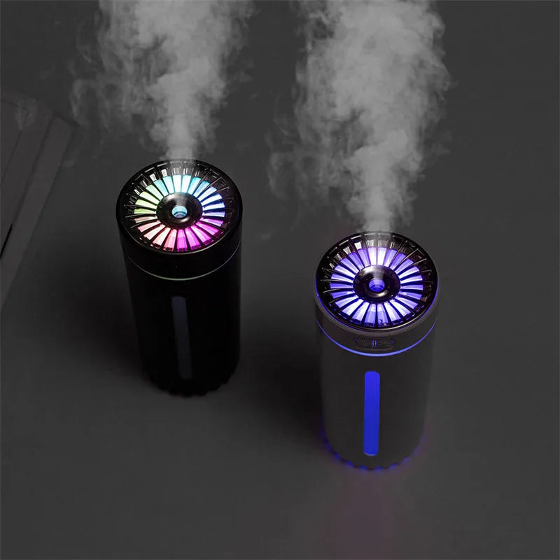 Black and white rechargeable USB humidifier with colourful lights for car and desk use.