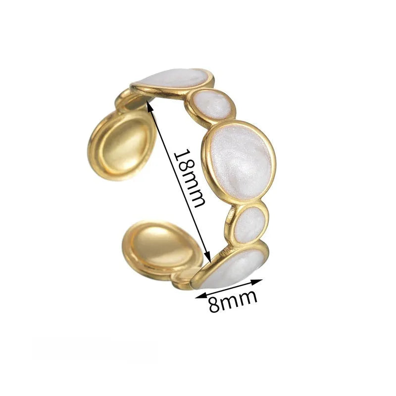Adjustable geometric ring in stainless steel with electroplated finish, showing open design for flexible sizing