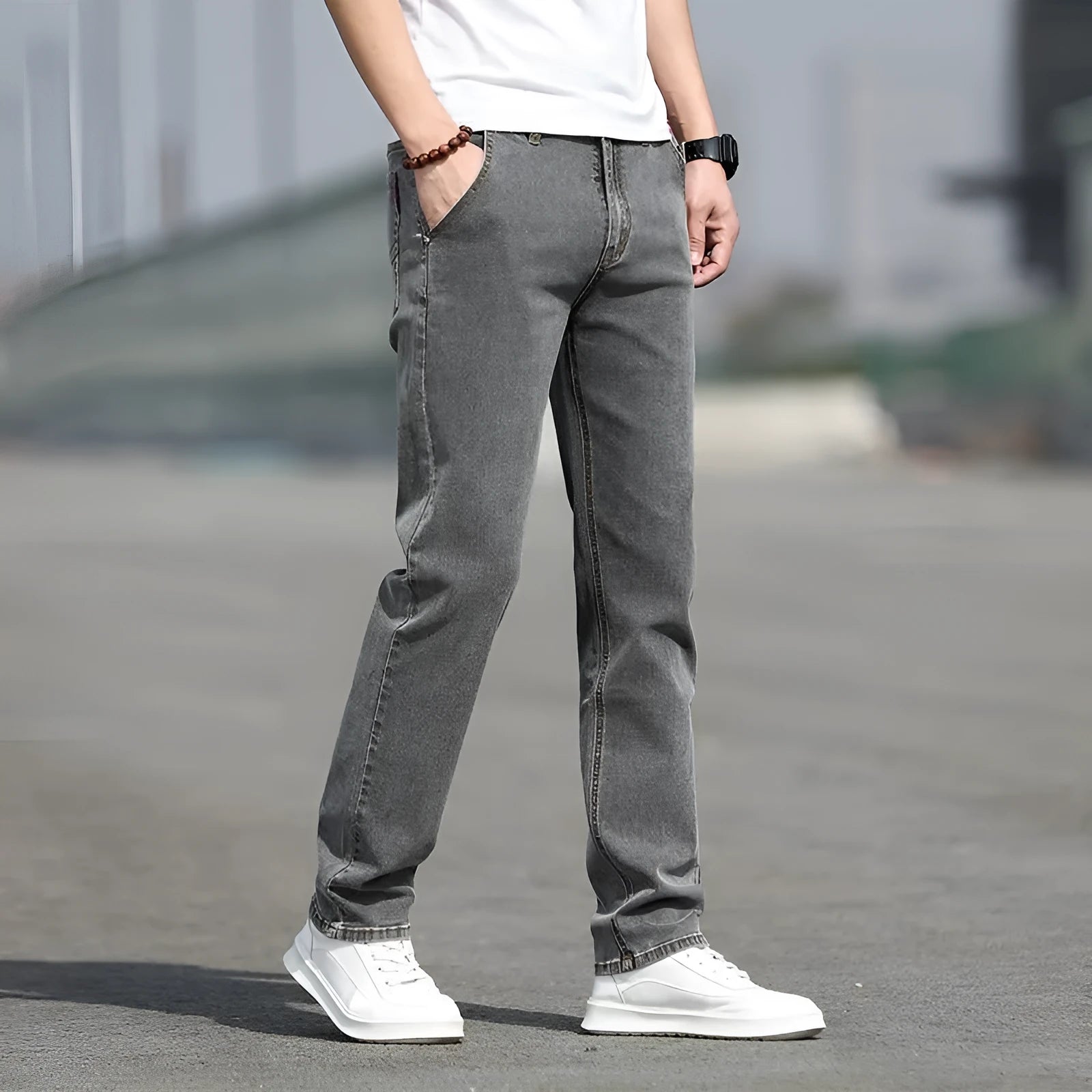 Men's smoky gray straight tube jeans with low waist and zipper fly closure