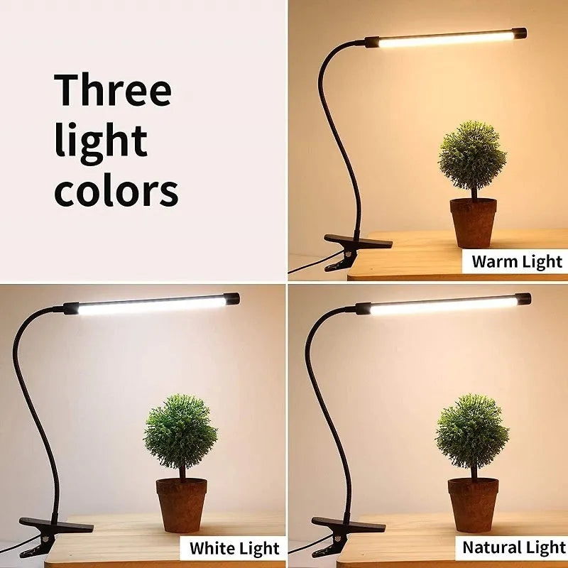 Black and white 26cm USB-powered LED desk lamp on a desk for study lighting.