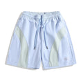 Black and grey loose-fit quick-drying sports shorts with elastic waistband above knee length