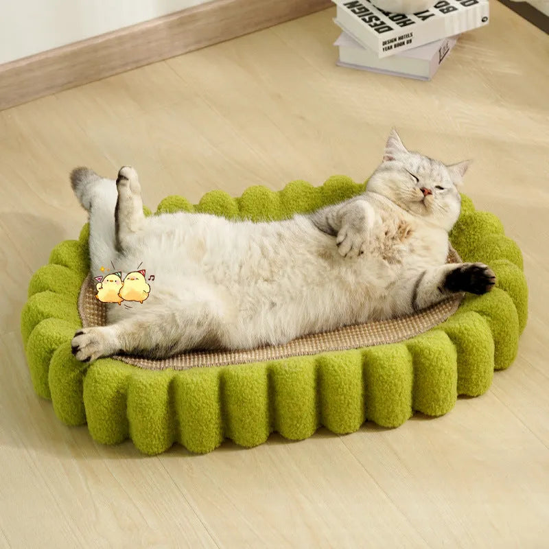 Green oval cat scratcher bed made from sisal, showing its bowl shape and textured scratching surface.