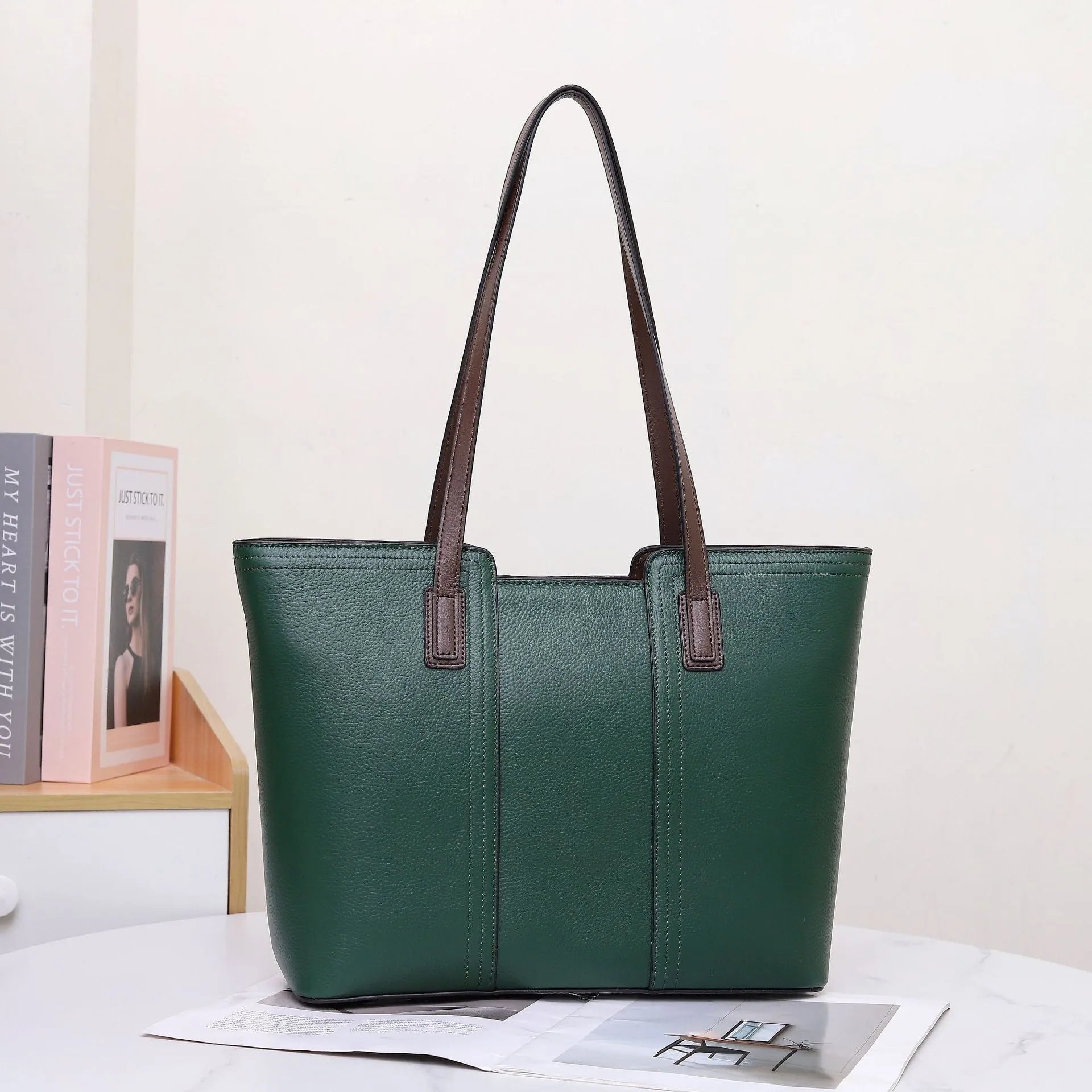 Women's genuine leather shoulder bag in khaki colour showing box-type design and organised interior compartments