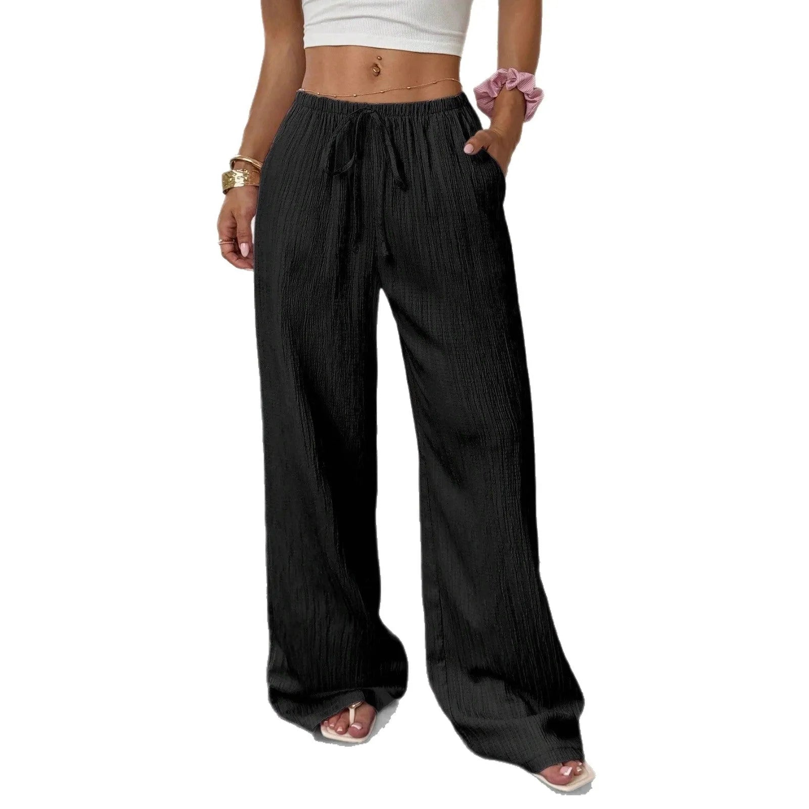 Women's black wide-leg trousers with lace-up waist trimming detail on mid-rise waist