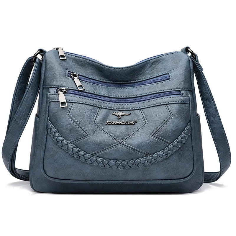 Women's black PU leather crossbody shoulder bag with large capacity and zipper compartment