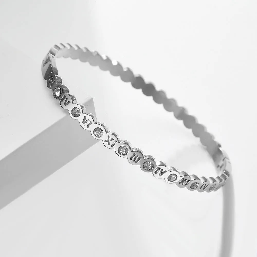 Titanium steel bracelet with number design in gold, rose gold, and steel colour options.