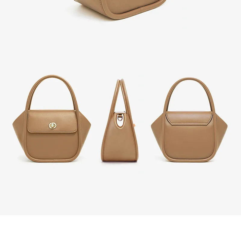 Women's leather wing-shaped tote bag with buckle closure in blue, grey, black, or brown colour options