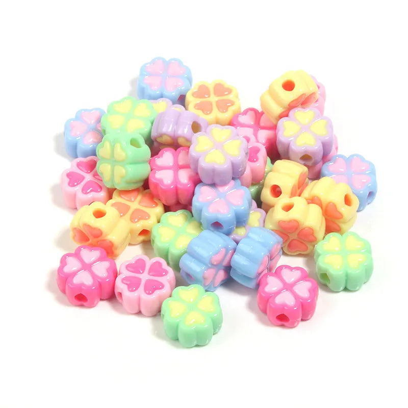 Assortment of 15mm frosted acrylic four-leaf clover beads in rose red, pink, yellow, green, blue, and purple colours.