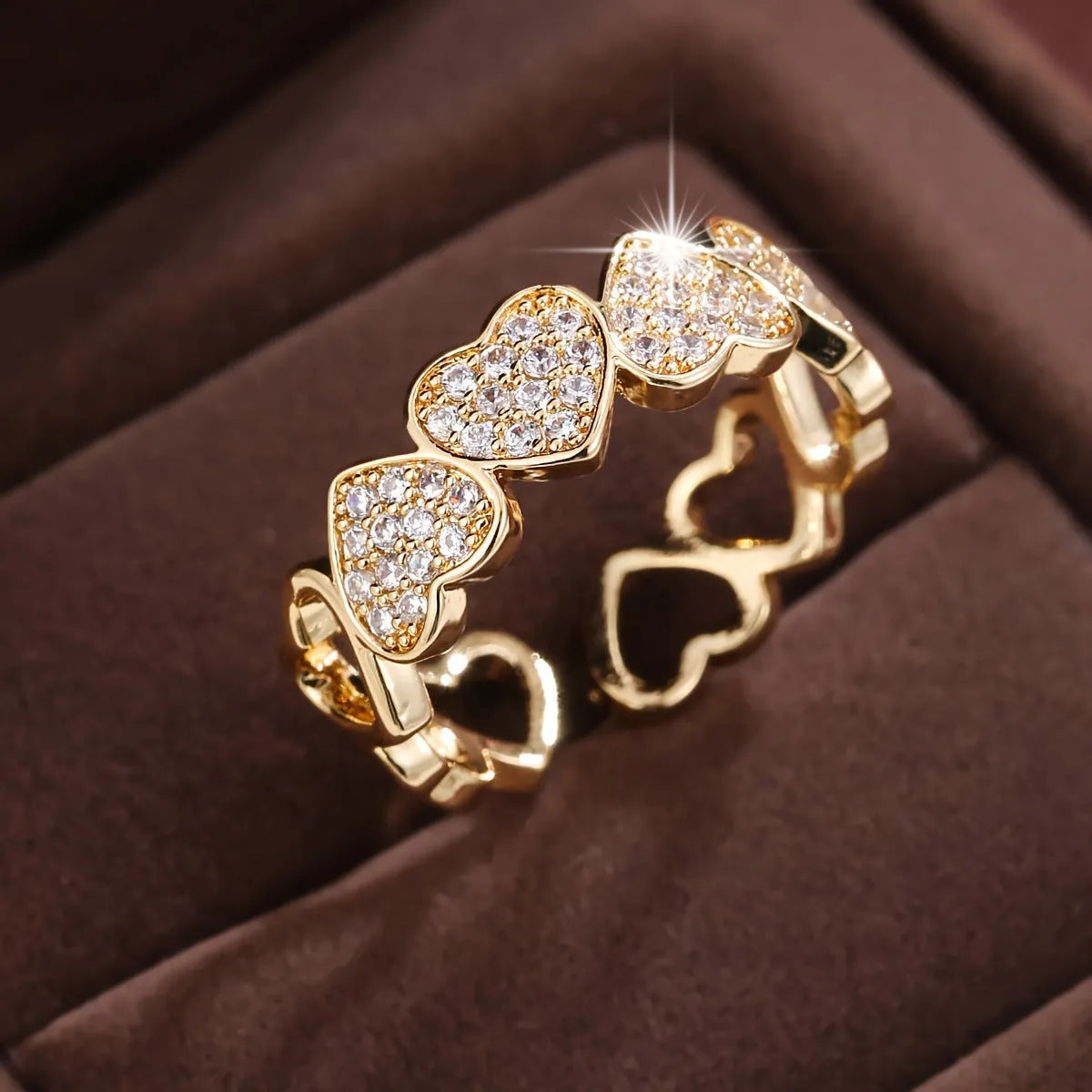 Geometric adjustable opening couples ring with heart design in gold or silver colour.