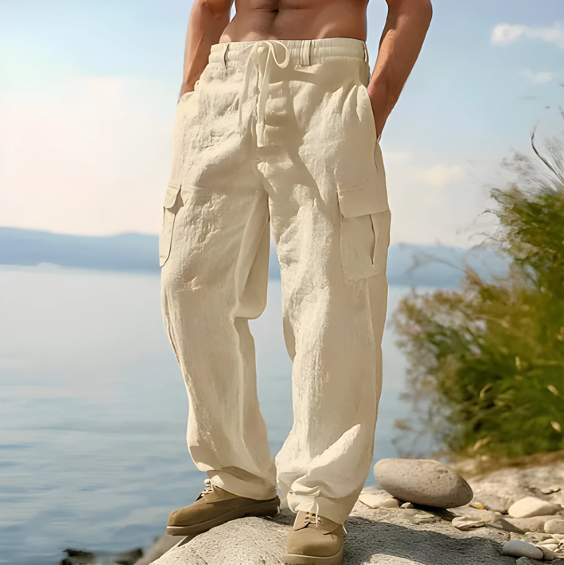 Men's loose cotton wide-leg casual trousers in light army green colour on a hanger.