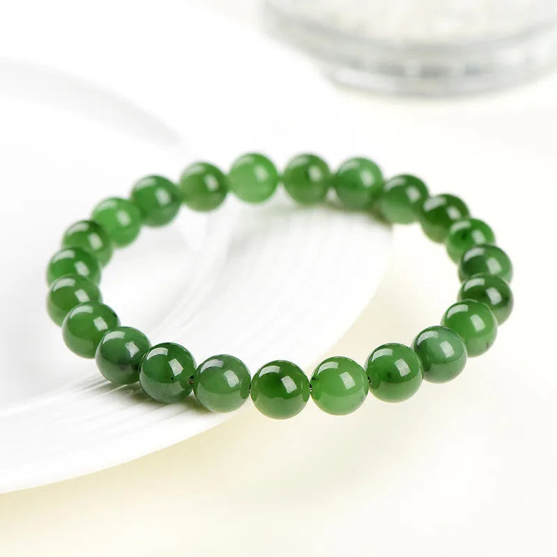 Natural Hetian jade jasper bead bracelet with polished finish in earthy green tones