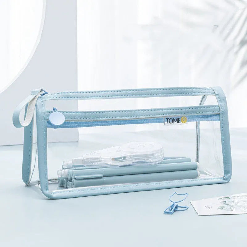 Large transparent double-layer pencil case in blue showing internal compartments, dimensions 220x110x80mm.
