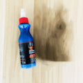 Small blue container of car scratch repair agent with sponge applicator for vehicle paint touch-ups