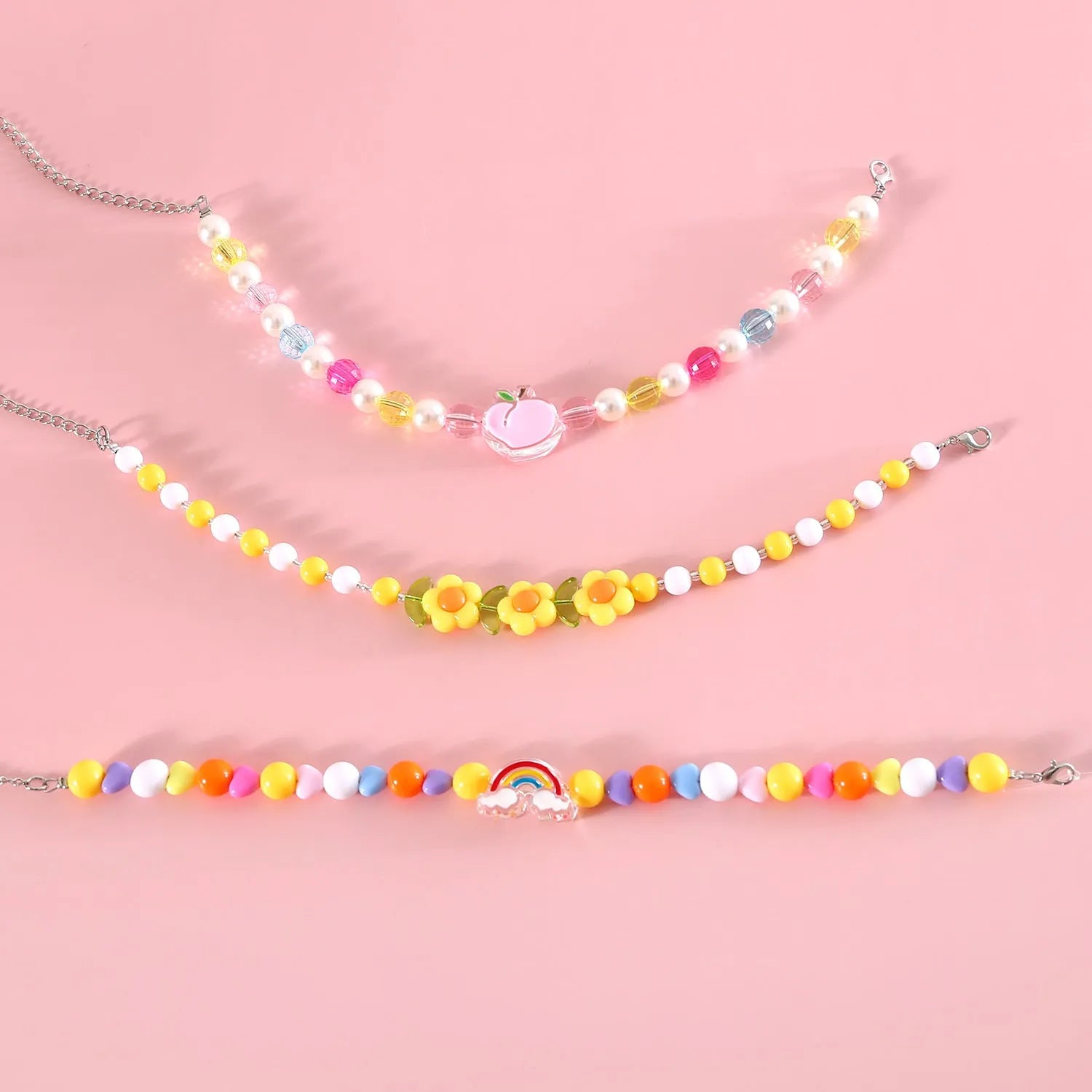 Colourful plastic bead necklace for small pets in rainbow, peach, or small flower patterns with adjustable sizing