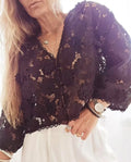 Women's loose fit polyester lace cardigan with V-neck and three-dimensional lace flower decoration.