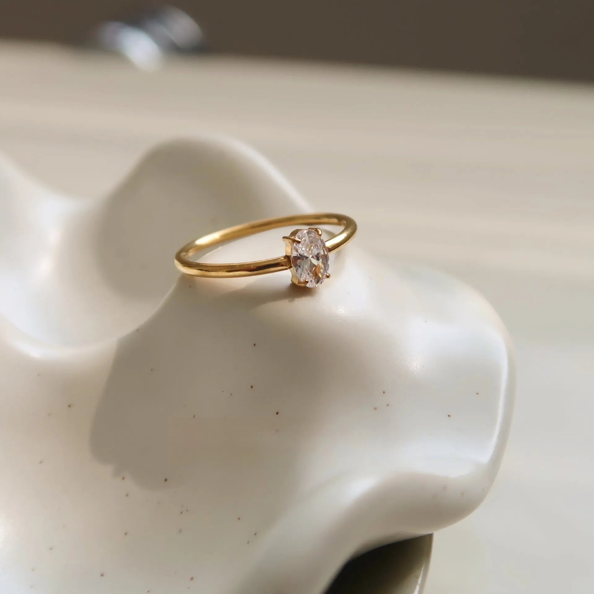 Golden electroplated stainless steel ring with love heart shape and oval bath design