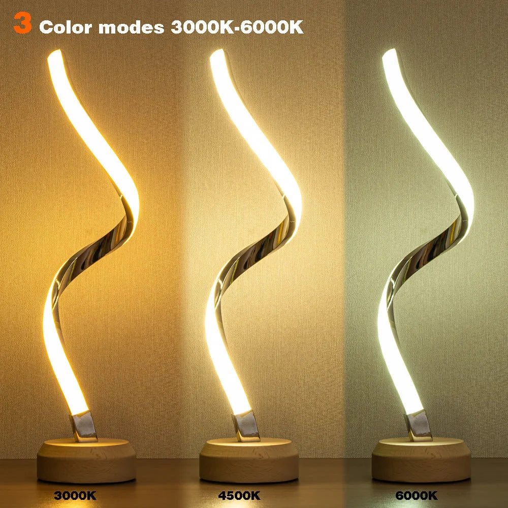 LED spiral table lamp with wooden curved base and USB cable, glowing warm white light
