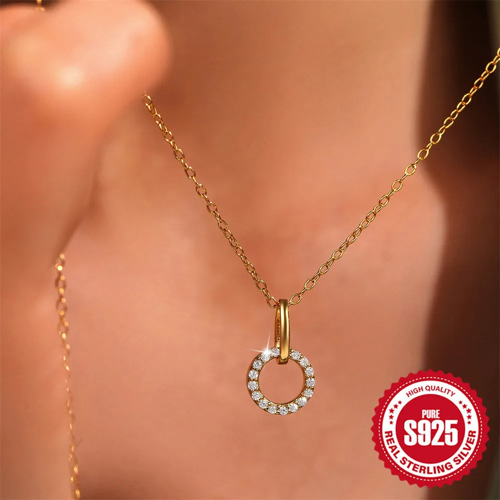 Gold-coloured S925 sterling silver adjustable clavicle chain necklace with round geometric zircon pendant.