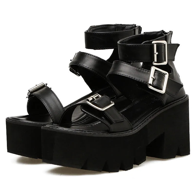 Black women's punk-style sandals with chunky heel, round toe, back zipper, and decorative buckle.