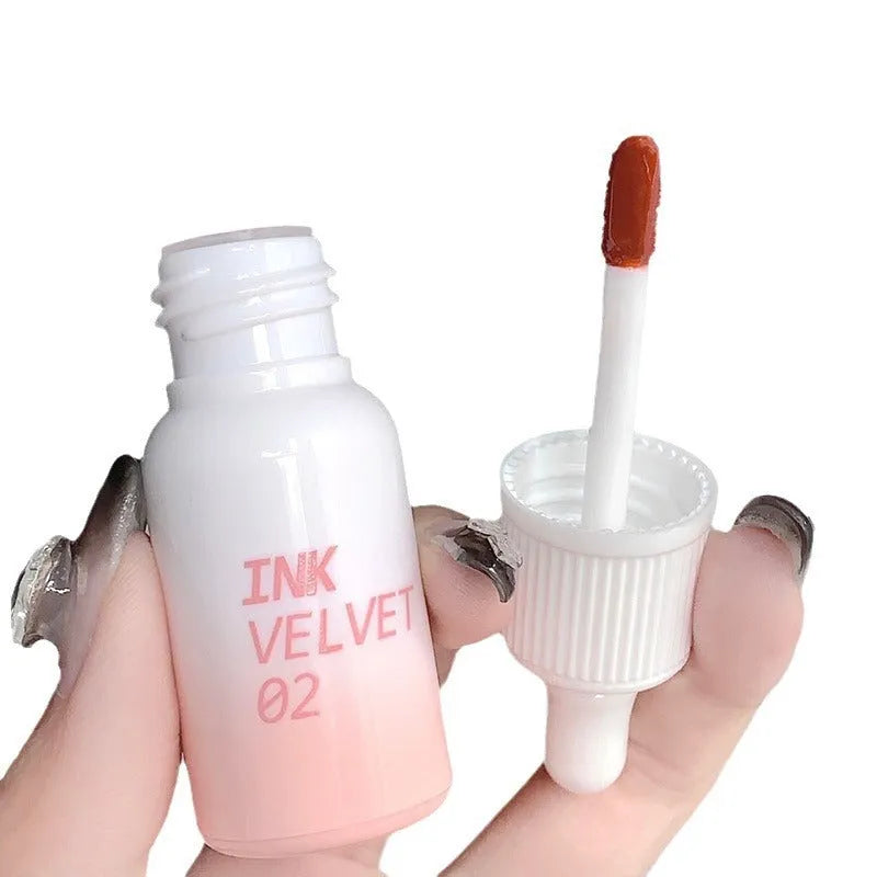 Mirror Lip Lacquer tube in one of four shades: Spring Day Wilderness, Orange Tabby Cat Diary, Low-Key Charming, or Misty Berry.