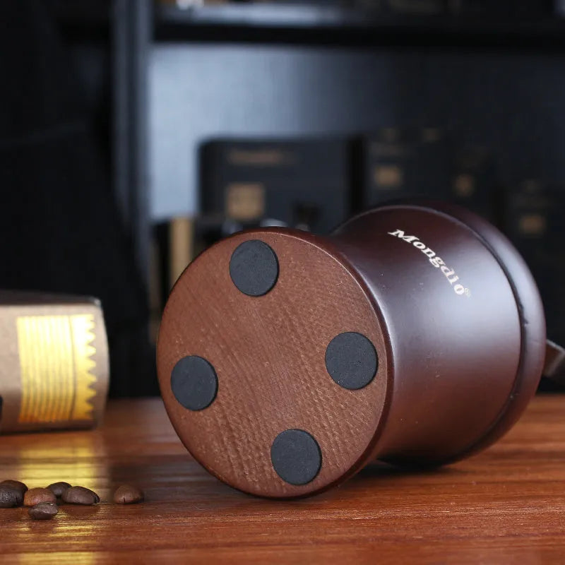 Solid wood barrel manual coffee grinder with hand crank in natural coffee colour