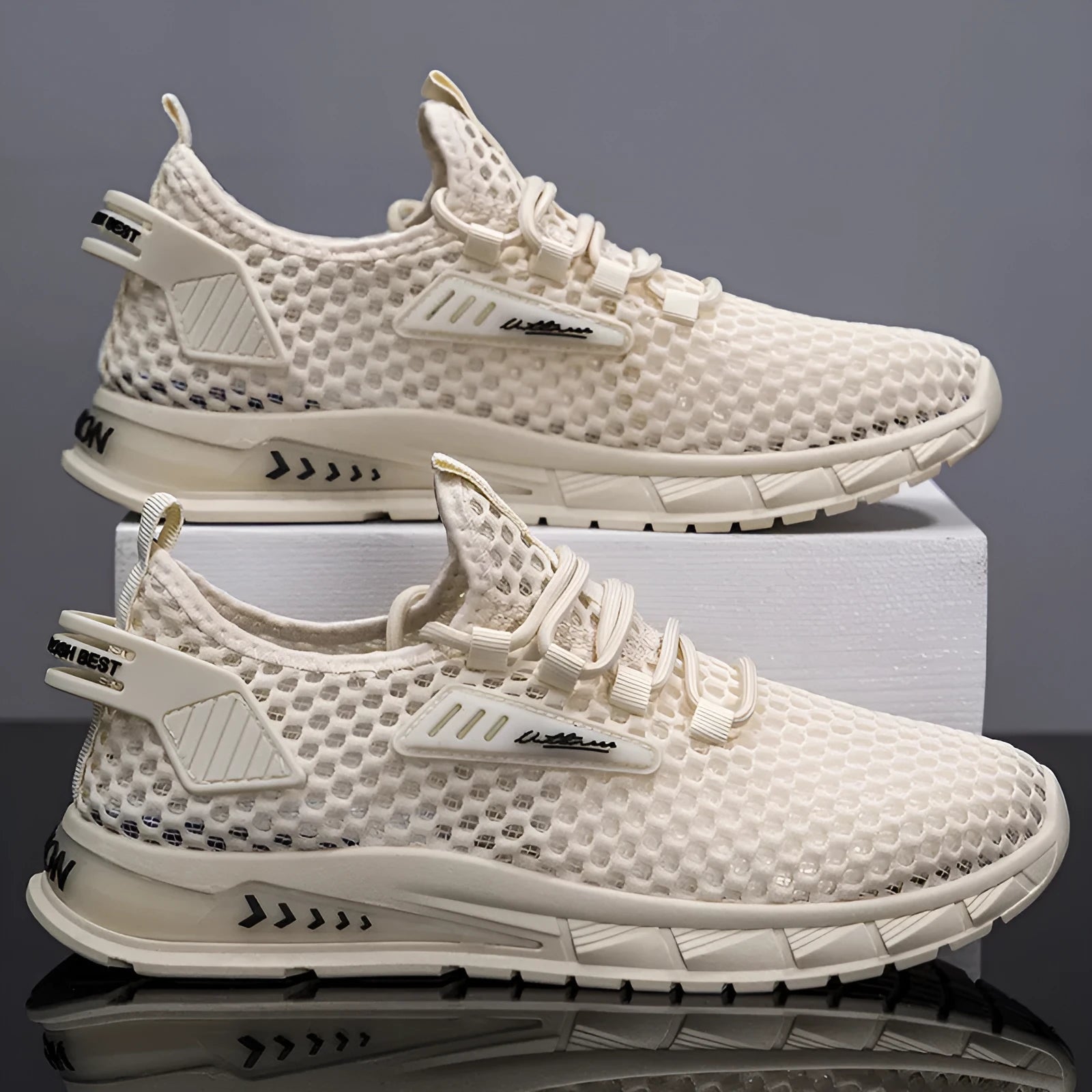 Men's beige casual sneaker with mesh detail, synthetic leather upper, and flat EVA sole on a plain background.