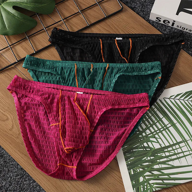 Men's low-waist lace briefs in ice silk fabric on a white background, shown in green colour.