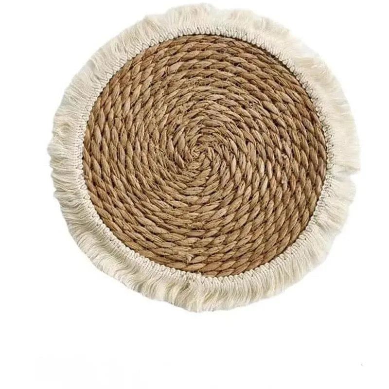 Japanese straw round placemat with tassel trim in natural papyrus material on dining table