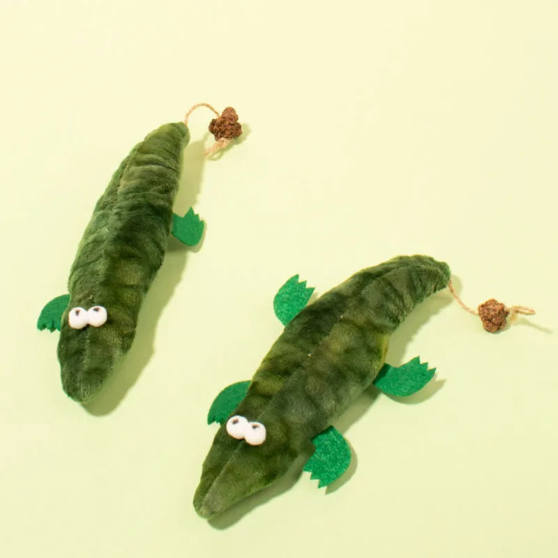 Green plush alligator catnip toy with peppermint scent for feline oral care and play