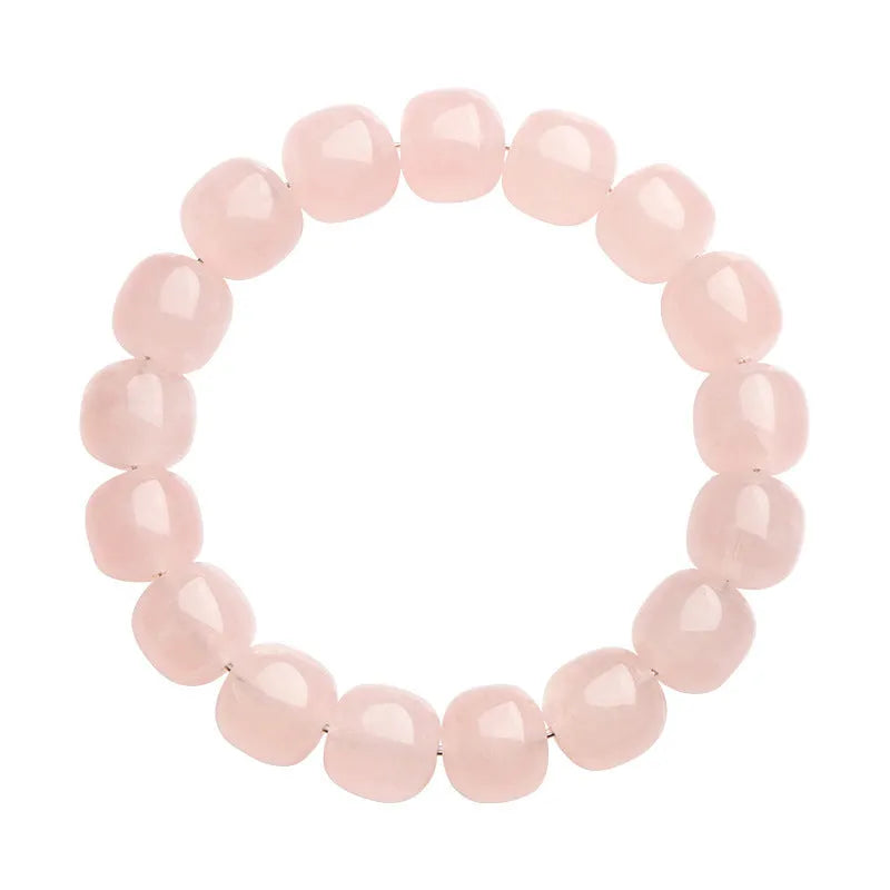 Pink crystal barrel bead bracelet with 11-12mm geometric beads on natural background
