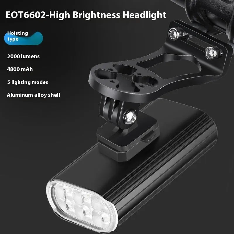Aluminium alloy bicycle front light with 6 LEDs, USB Type-C port, and quick-release mount on handlebars.