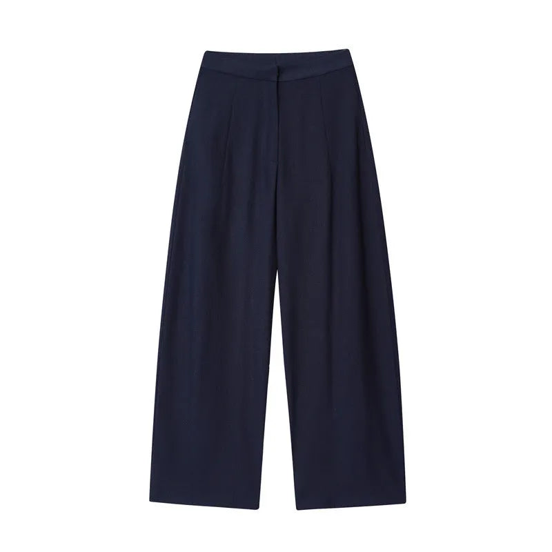 Women's linen blend long sleeve shirt with flounce detail and matching wide leg trousers set on a hanger.